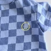 Kép 2/2 - Kék-fehér kockás pamut napozó kisfiúknak, Nutmeg márka – 0–3 hó (62)