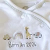 Kép 2/2 - 56-os Next pamut Born in 2024 rugdalózó kisfiúnak