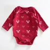 Kép 1/2 - 62-es meggypiros karácsonyi body Minnie-mintával – Disney Baby, 0-3 hónapos babáknak