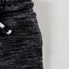 Kép 2/2 - 80-as Next kisfiú jogger melegítőnadrág szürke-fekete – 9-12 hónap