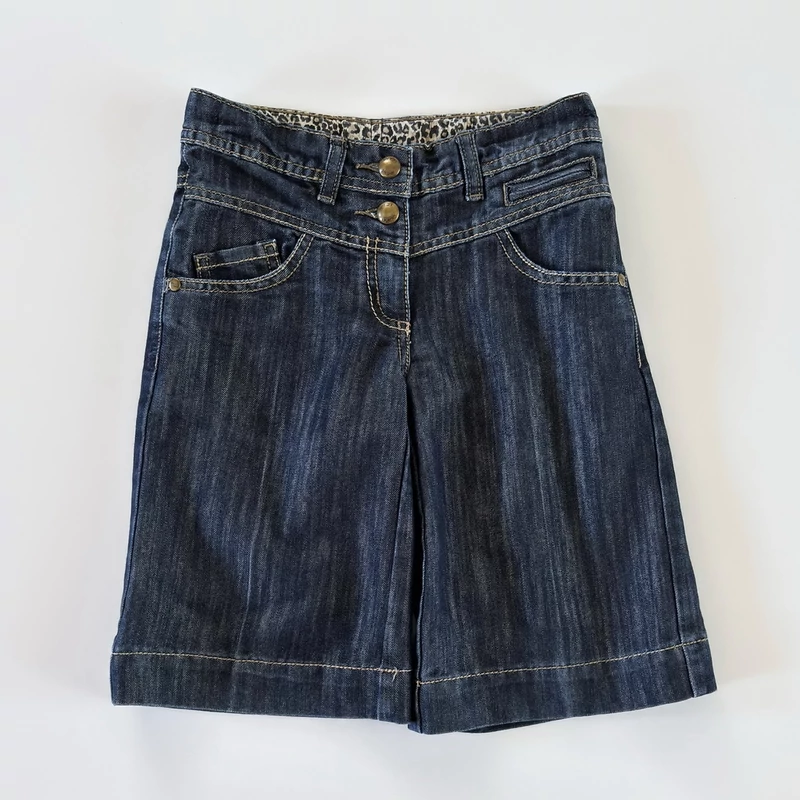 Next hosszabb fazonú sötétkék farmer kislány short 122-es méretben
