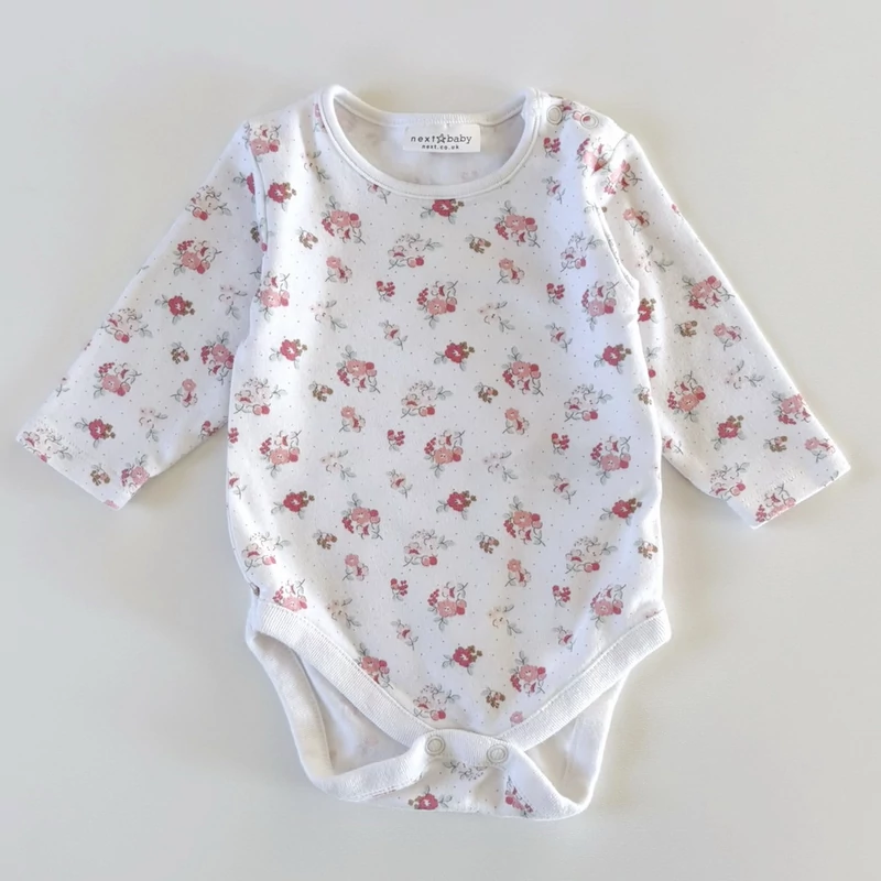 62-es Next virágmintás hosszú ujjú pamut kislány body