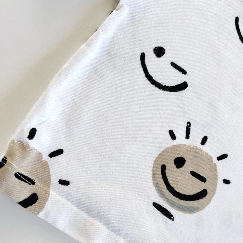 Next fehér pamut kisfiú póló smile mintákkal, 68-as méret