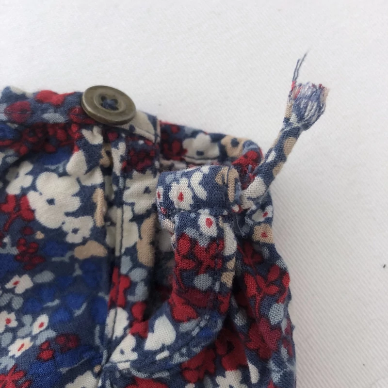 7 év Next virágos playsuit 122