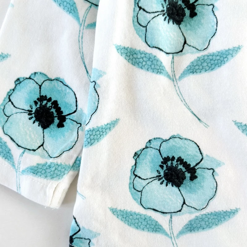 74-es Next kislány pamut felső türkizkék virágokkal